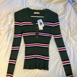 Size Medium. Sweater material. Stretches to fit body. Never worn.